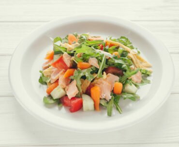 Salad with baked salmon and vegetables